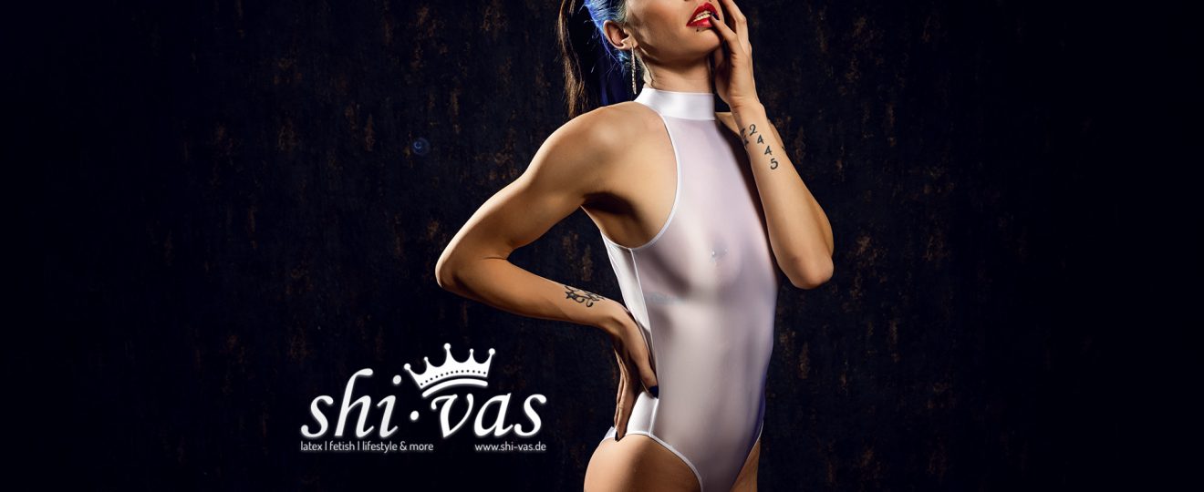 Coco fetish fashion model in an editorial photoshoot wearing a minimalist onepiece outfit